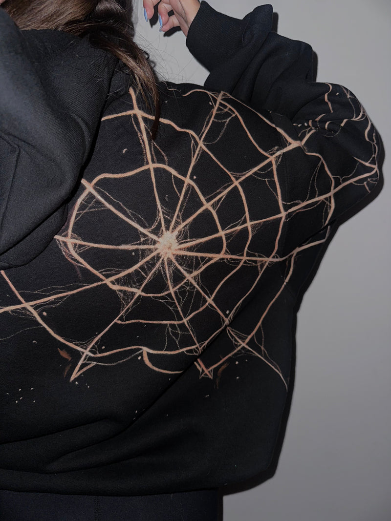 Black hoodie with spider web design on the back, Portugal.