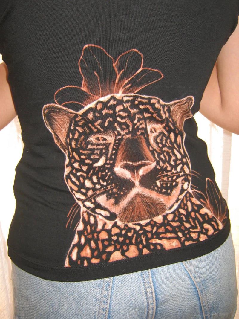 Black tank top with a leopard design on the back, worn by a person.