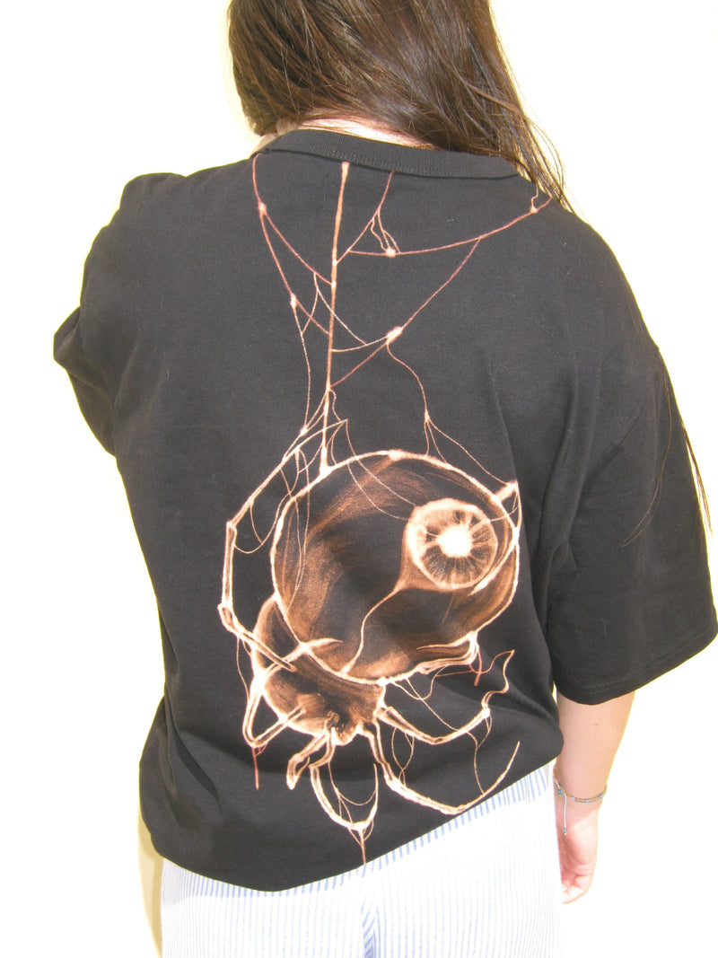 Black t-shirt with a detailed spiderdesign on the back.