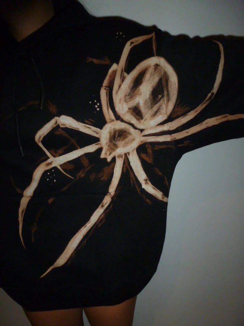 Black dress with a large white spider design on a black hoodie