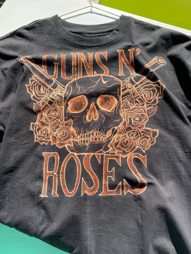 Black t-shirt with 'Guns N' Roses' graphic design.
