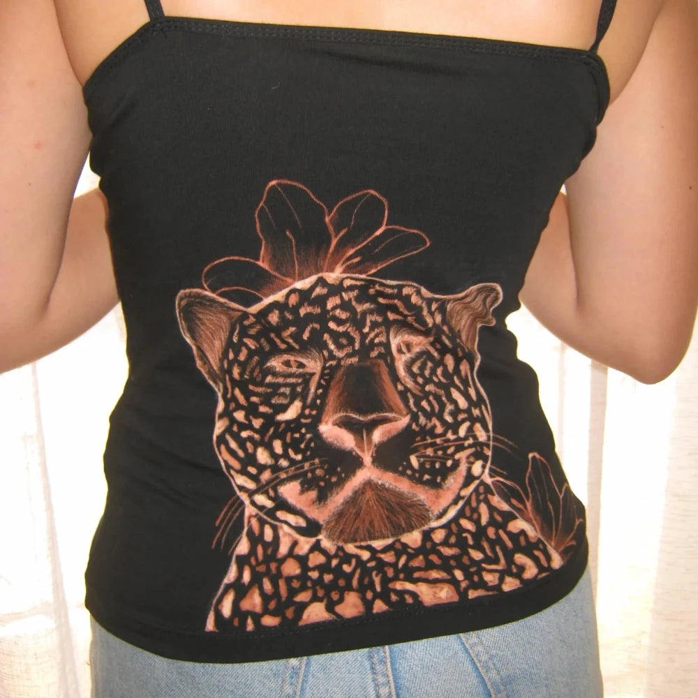 Black tank top with a leopard design worn by a person