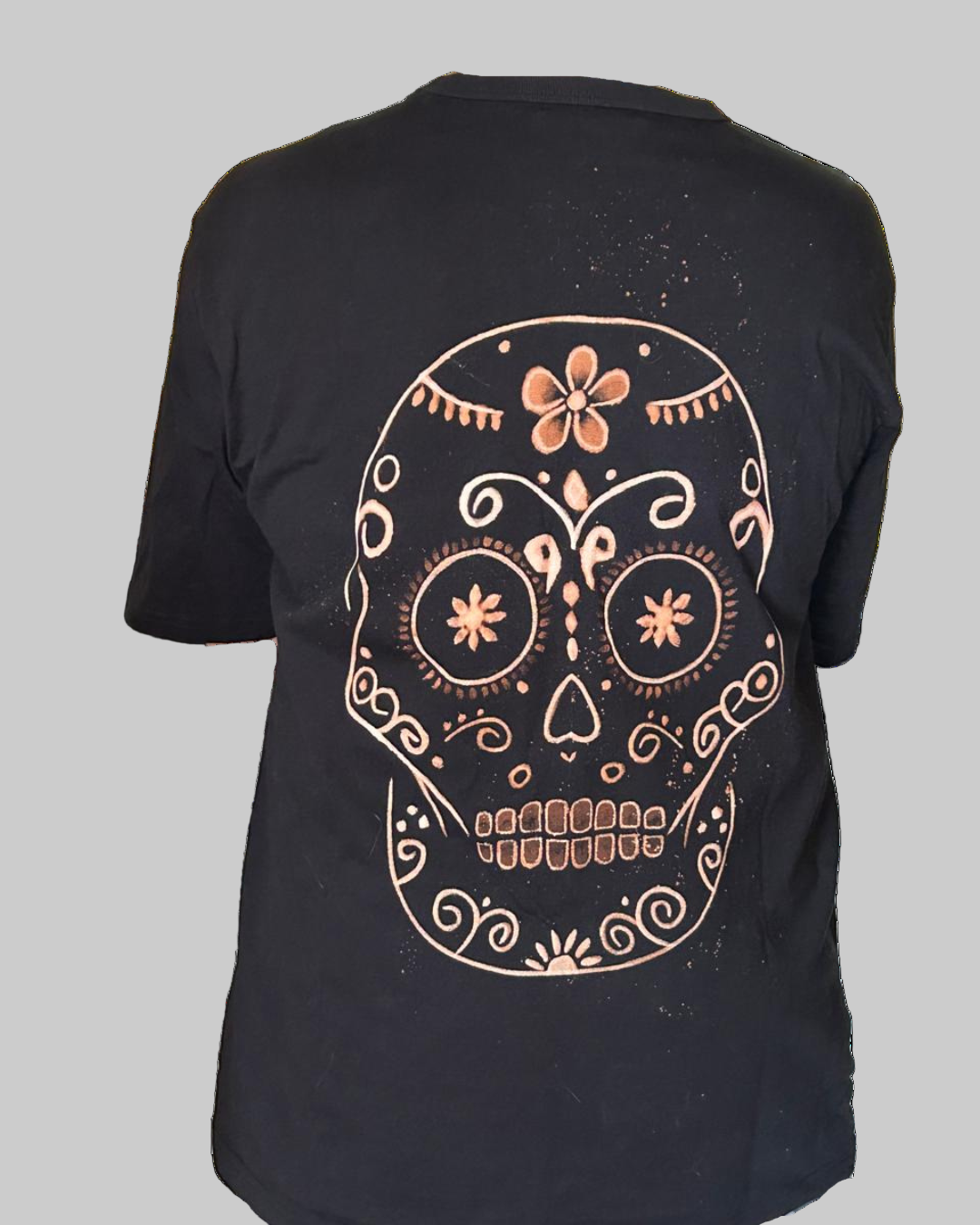 Black t-shirt with a bleach sugar skull design on the back, Portugal.