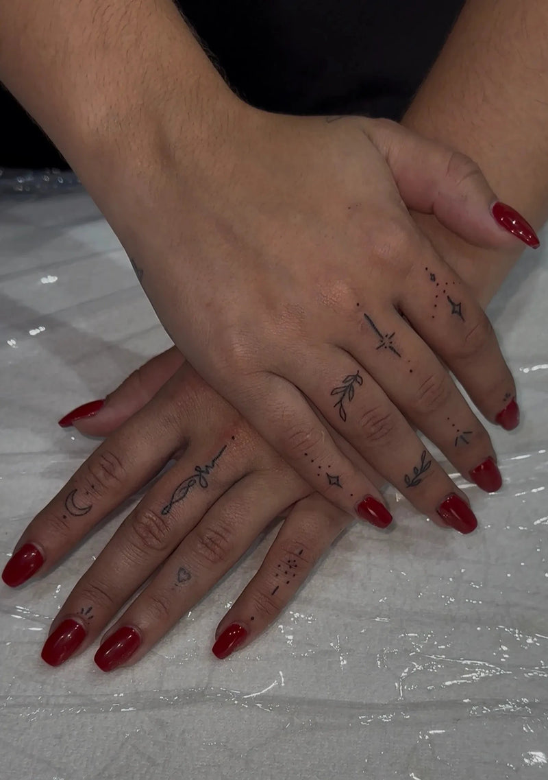 Hands showing Finger tattoos, Almancil