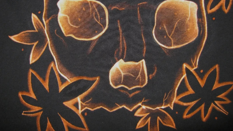 thINK Studio Portugal, hand-painted skull design on a dark shirt.